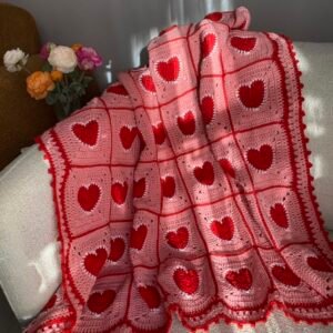 A-crochet Blanket in tea-pink & red with heart motifs