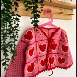 A-crochet sweater in tea pink & red with heart motifs